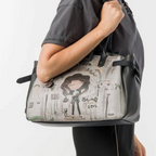 Lieblingstasche shoulder bag featuring a whimsical illustrated girl graphic with Sing Your Soul text on grey leather