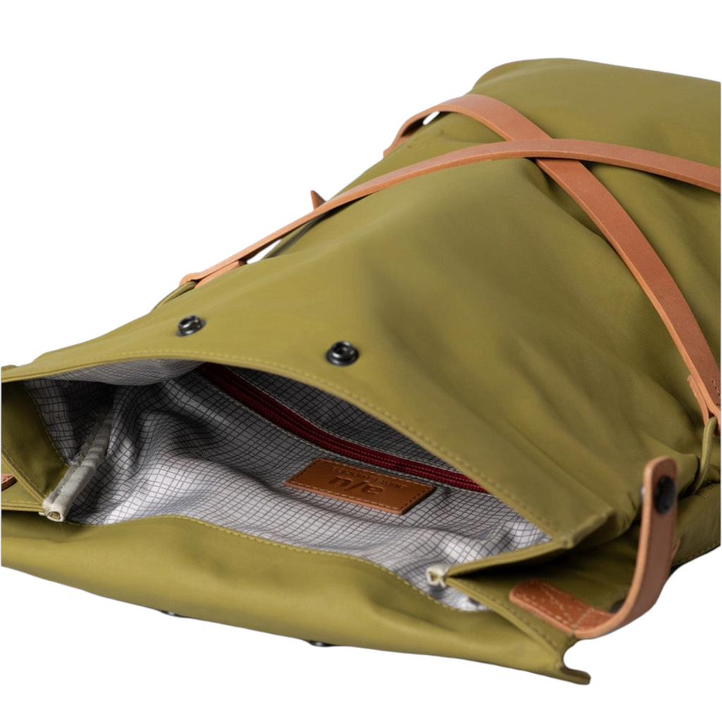Lieblingstasche Yokohama olive green backpack with tan leather straps and a patterned interior lining