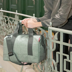 Lieblingstasche Allrounder M travel bag in heathered green polyester with sturdy handles and shoulder strap