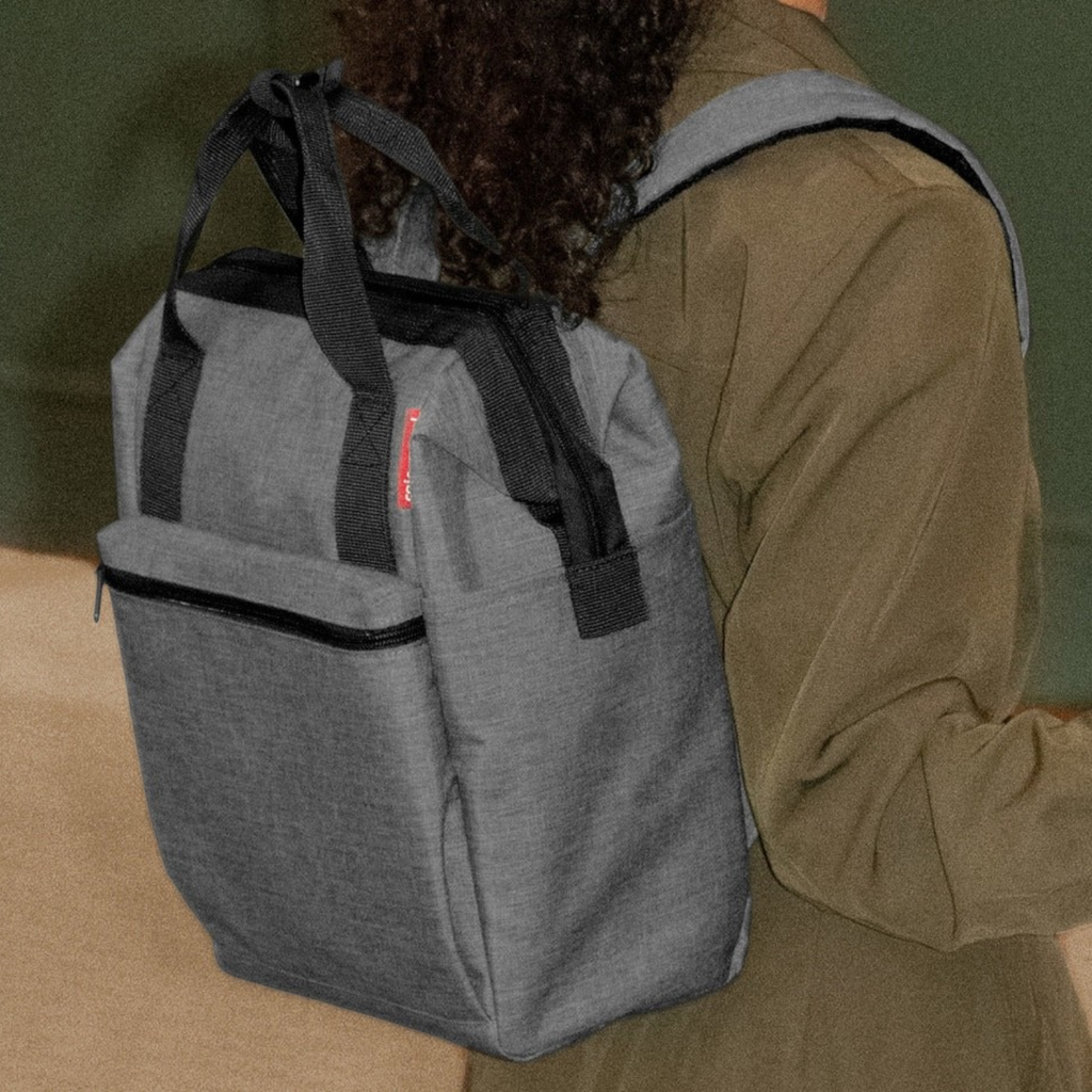 Lieblingstasche Allrounder R insulated backpack in grey worn on the back with black handles and zipper details