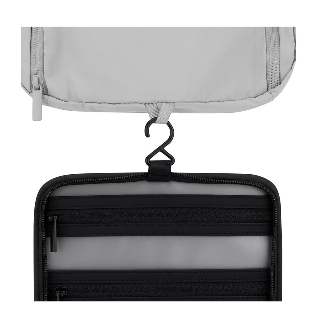 Lieblingstasche Bali washbag featuring a hanging hook, black zippered compartments, and a light grey exterior.