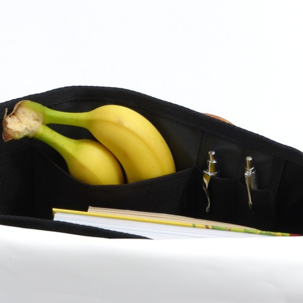 Lieblingstasche Barkasse bag interior with black fabric organizer pockets holding bananas and pens