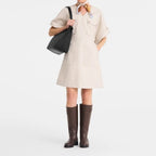 Lieblingstasche beige canvas short-sleeve dress with pockets and a black tote bag.