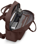 Lieblingstasche Bergen Pro brown backpack with open main compartment showing organized interior and water bottle