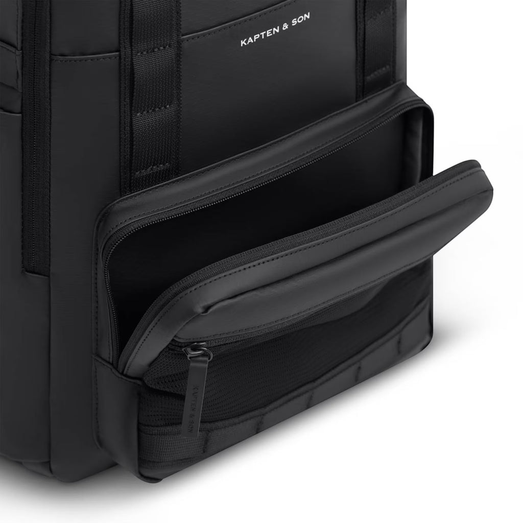 Lieblingstasche Bergen Ultra black backpack with an open front zippered pocket showing mesh interior compartments