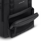 Lieblingstasche Bergen Ultra black backpack with an open front zippered pocket showing mesh interior compartments