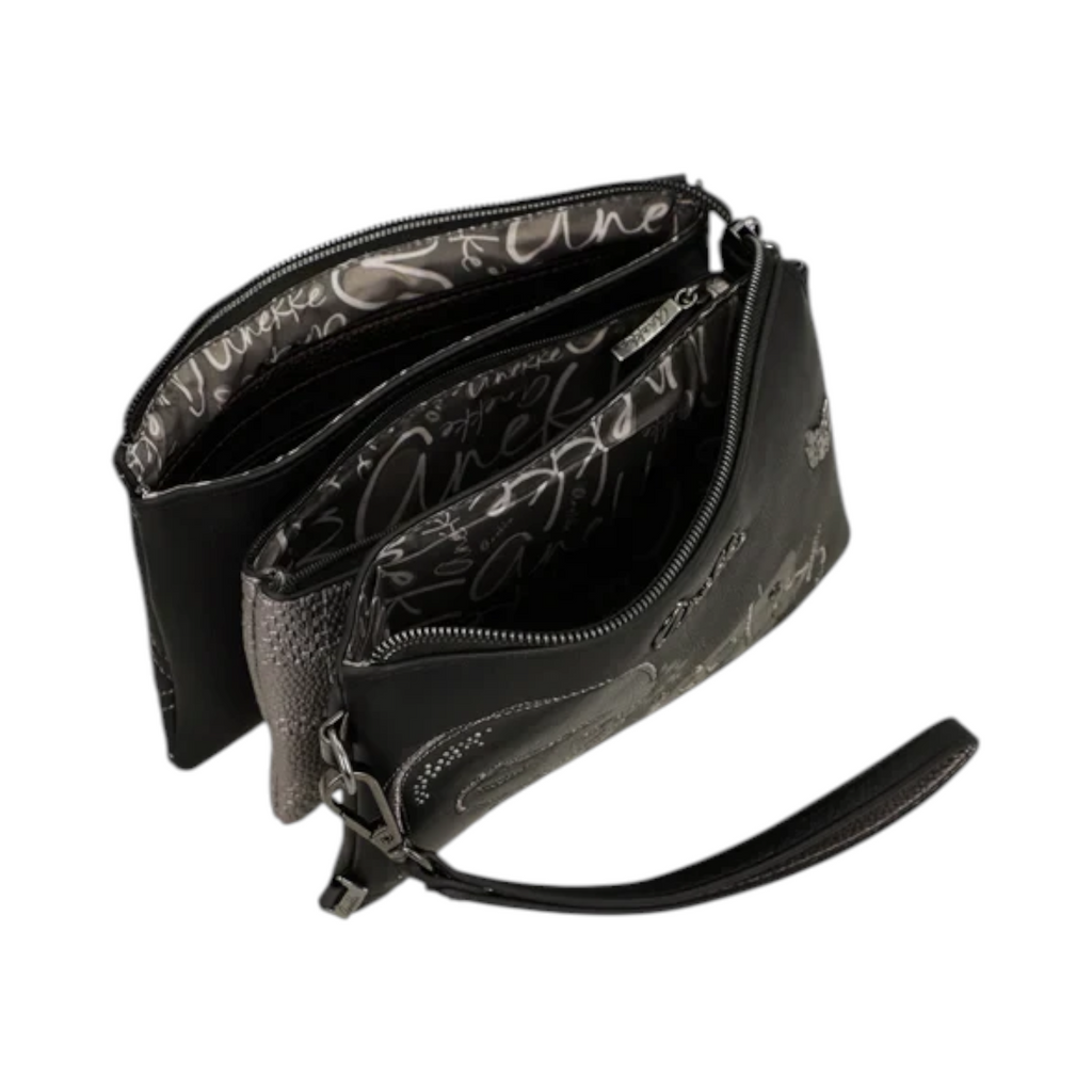 Lieblingstasche black cross-body bag with multiple zippered compartments and patterned interior lining