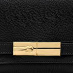 Lieblingstasche Le Smart Flow Umhängetasche S in black grained leather with a polished gold-tone metal clasp detail.