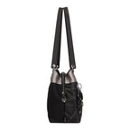 Lieblingstasche shoulder bag in black with metallic silver accents, featuring decorative stitching and side charms.