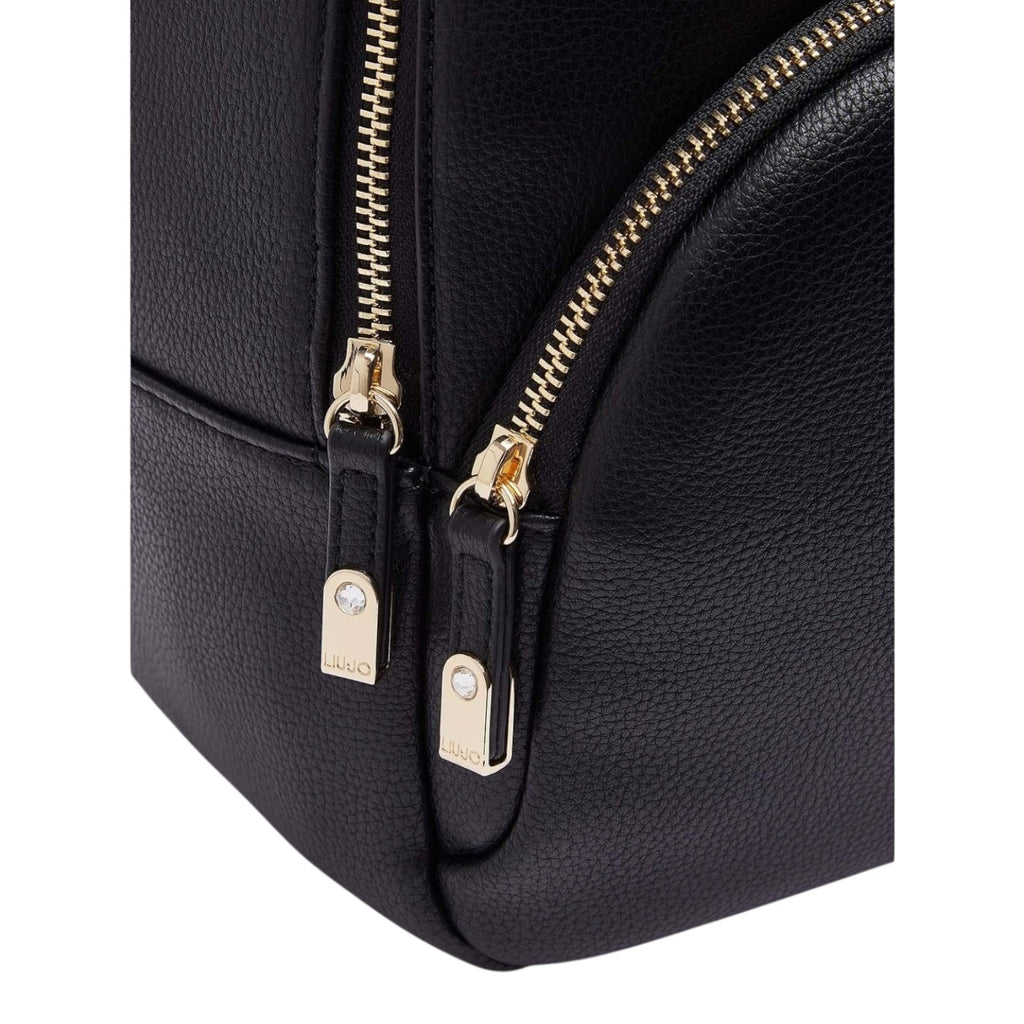 Lieblingstasche ECS Backpack M in black pebbled faux leather with gold-tone metal zippers and branded pull tabs