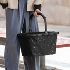 Lieblingstasche Carrybag in black with polka dot pattern, featuring a sturdy aluminium handle for comfortable carrying.