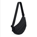 Lieblingstasche Puffer Moon Bag Small in black made from recycled water-resistant material with adjustable strap.