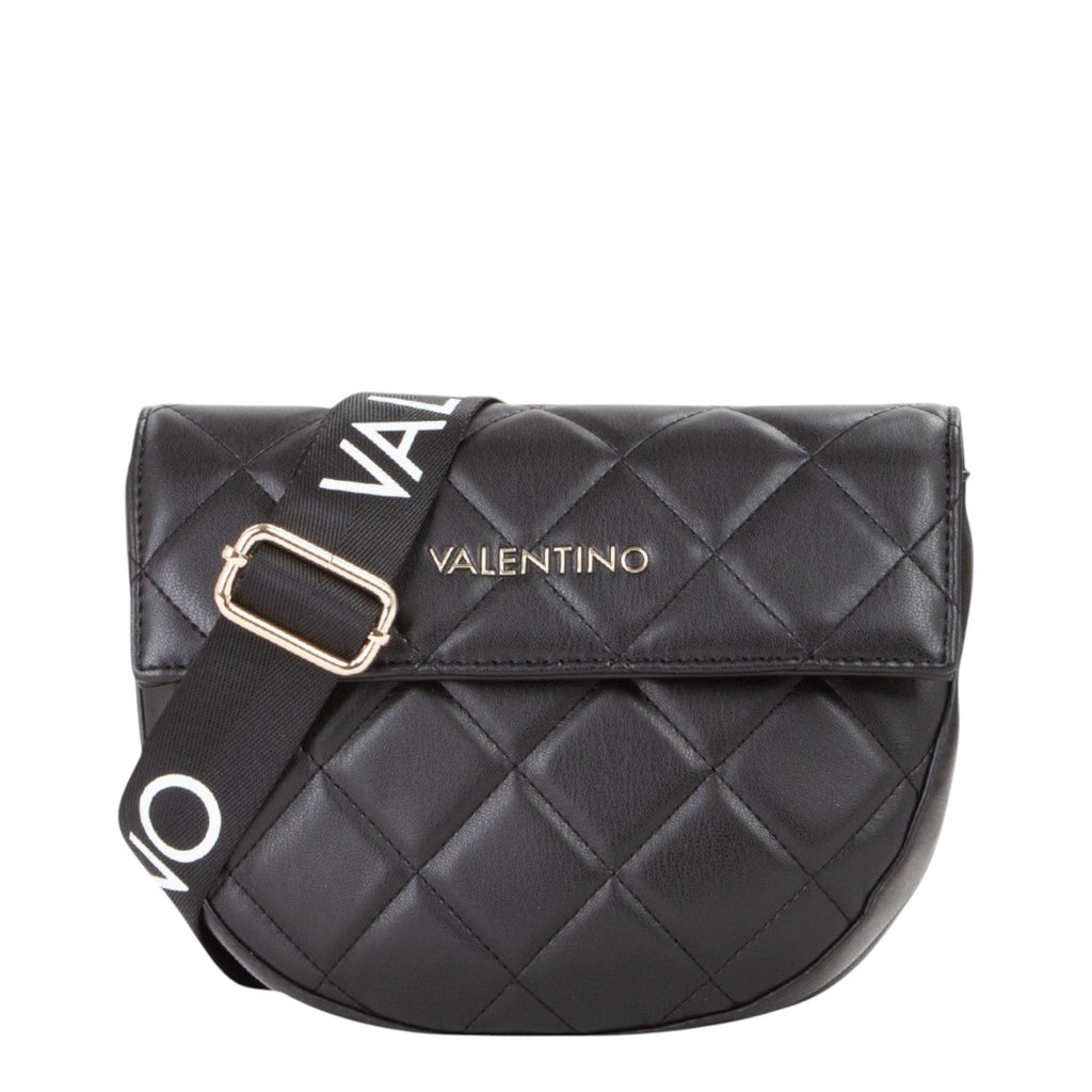 Lieblingstasche black quilted leather flap bag with adjustable logo strap and gold hardware.