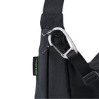 Lieblingstasche black sling bag with a silver carabiner and Eco & Social side label detail
