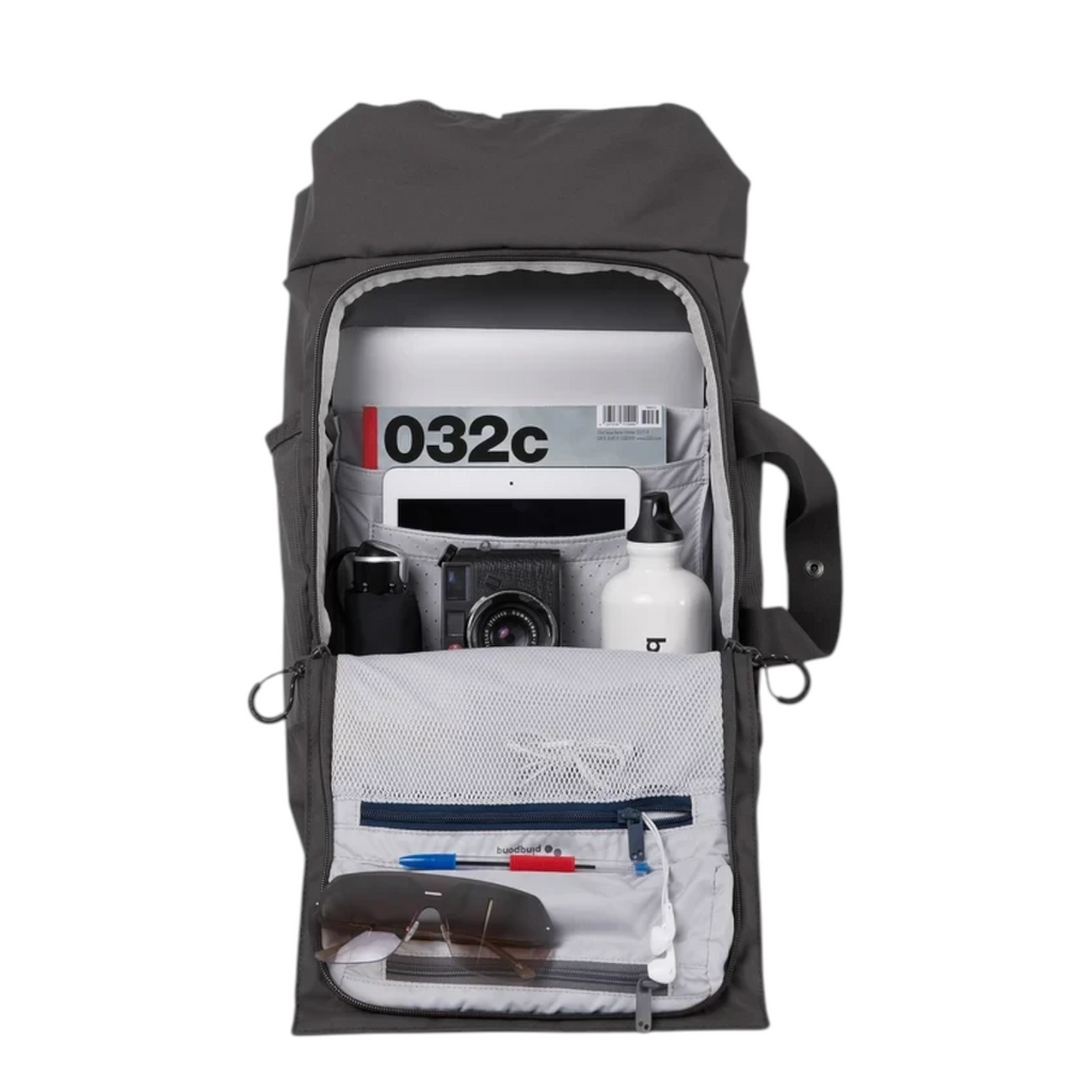 Lieblingstasche Blok Medium backpack in dark grey with open main compartment showing organized pockets and gear