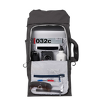 Lieblingstasche Blok Medium backpack in dark grey with open main compartment showing organized pockets and gear