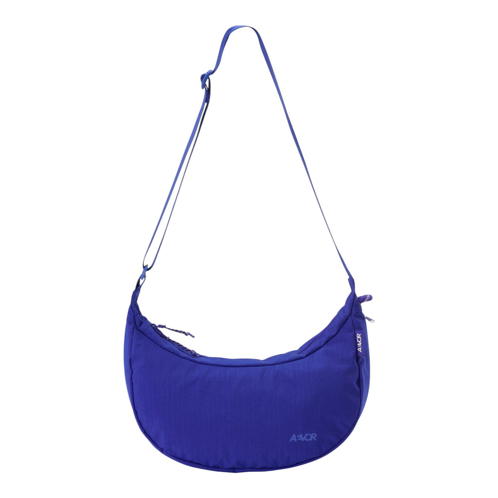 Lieblingstasche blue crescent-shaped sling bag with an adjustable shoulder strap and minimalist design