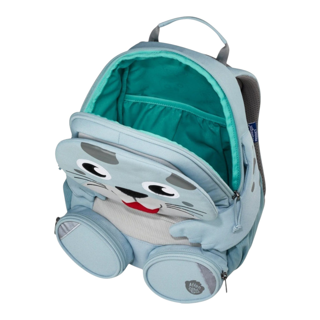 Lieblingstasche light blue seal-shaped backpack for kids with cute face and teal interior. Features two side zip pockets.