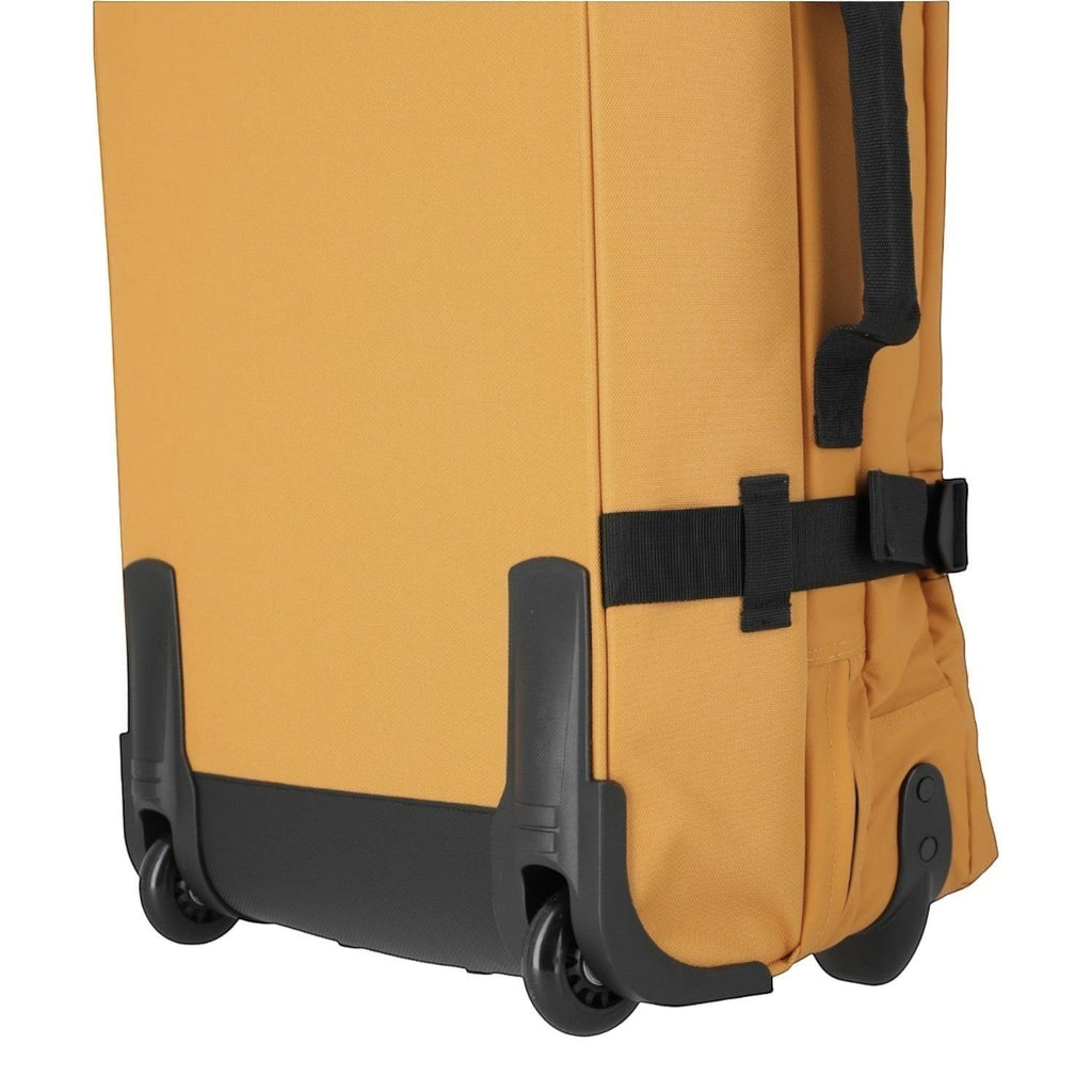 Lieblingstasche BOLONIA L travel bag in mustard yellow with black wheels and straps.