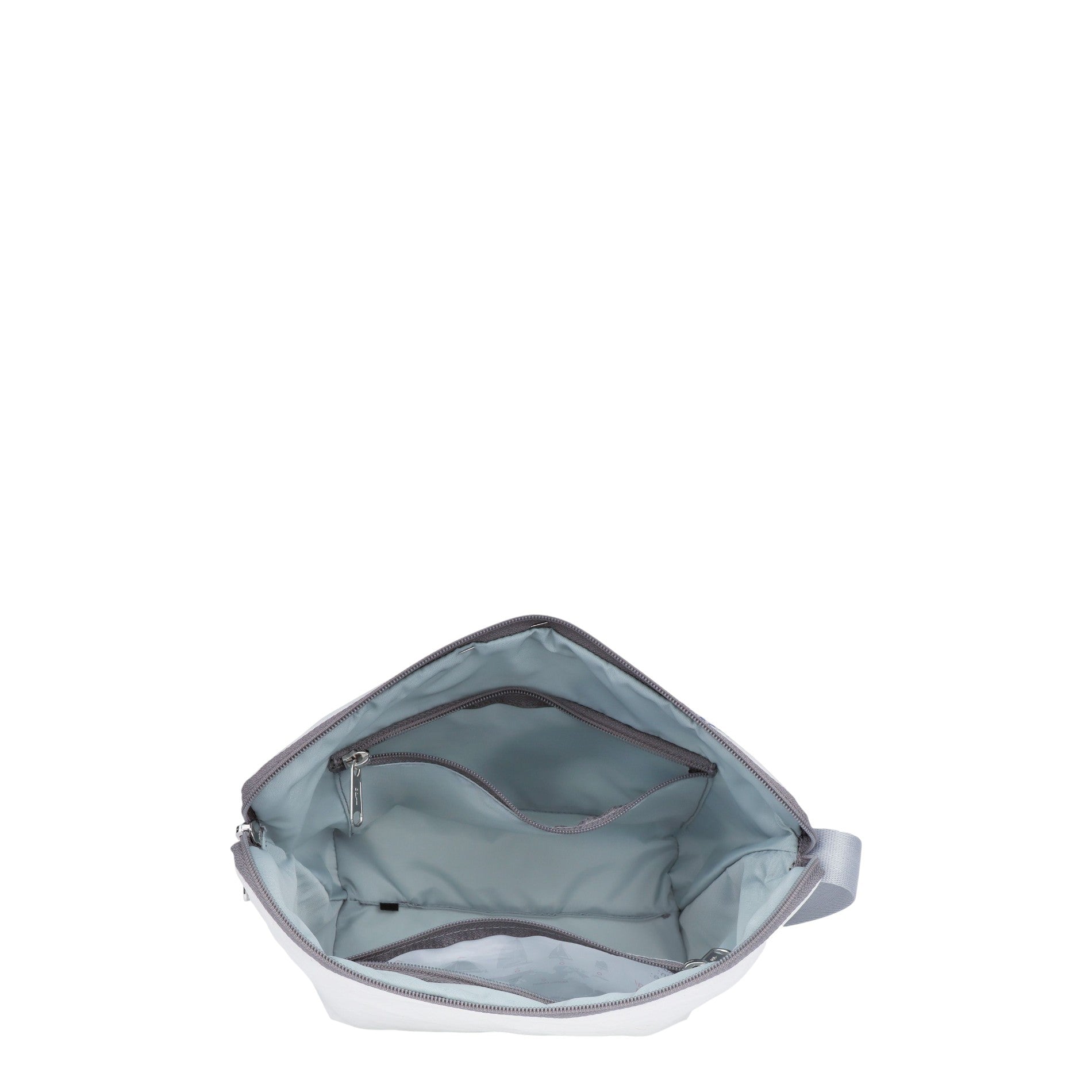 Lieblingstasche Brise bag interior showing light blue lining, multiple zippered pockets, and a spacious compartment.
