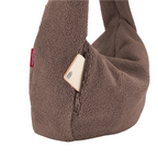 Lieblingstasche brown teddy fleece moonbag with a zippered side pocket containing a smartphone