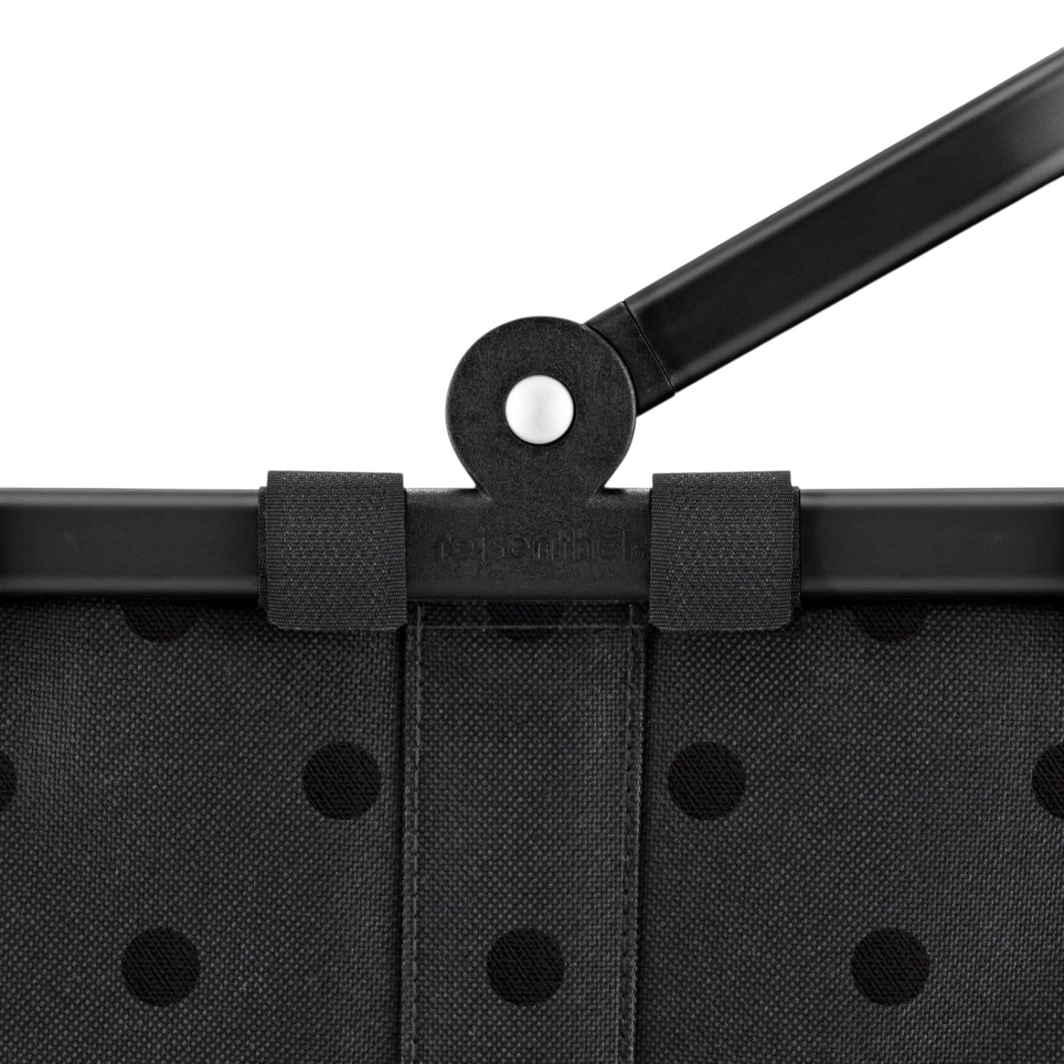 Lieblingstasche Carrybag XS in black with a subtle polka dot pattern and a sturdy black folding handle