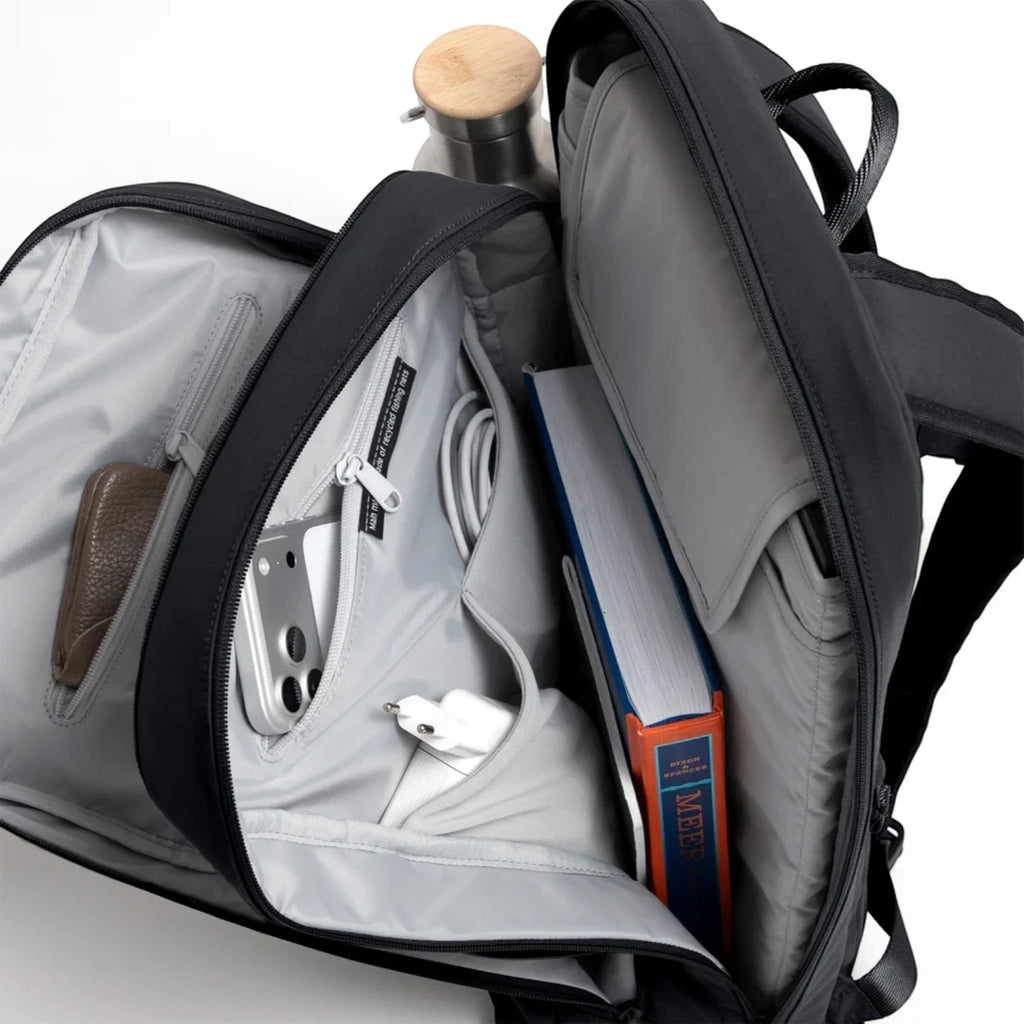 Lieblingstasche Commuter Pack in black with open compartments, internal pockets, and organized tech accessories.