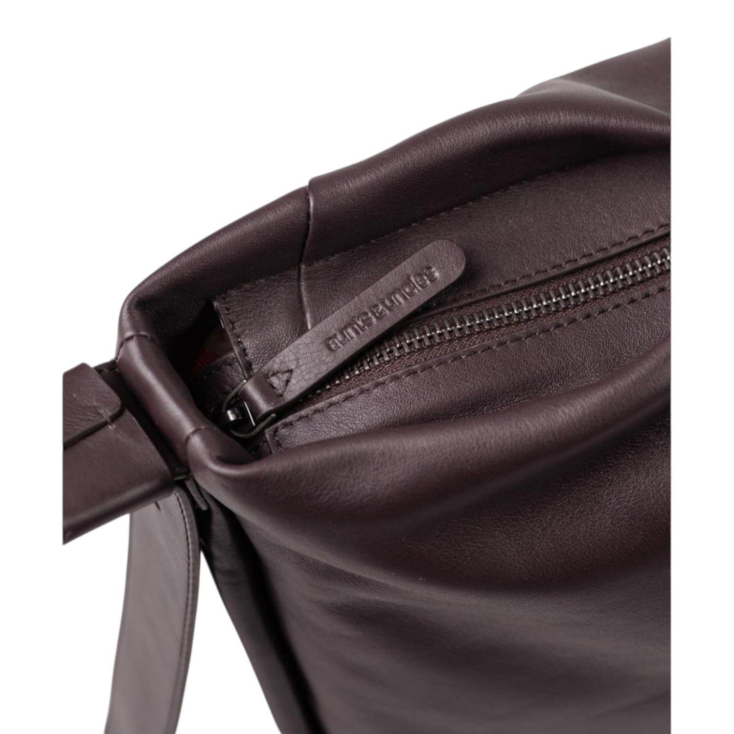 Lieblingstasche Coral dark brown leather handbag featuring a branded zipper pull and smooth texture