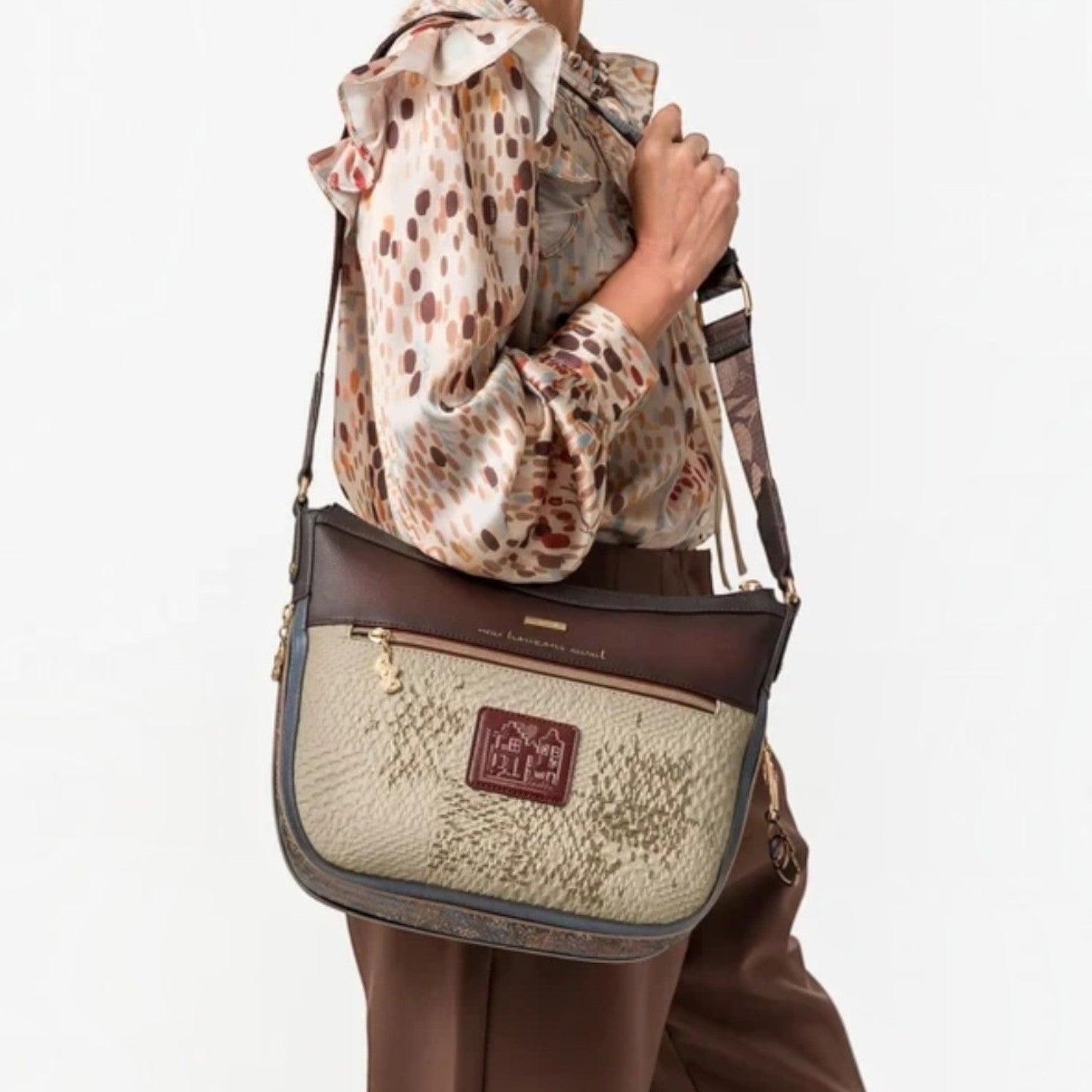 Lieblingstasche cross-body bag in beige and brown with textured patterns and a decorative logo patch