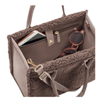 Lieblingstasche Daily Shopper XS in brown faux fur with internal pockets containing a smartphone and sunglasses