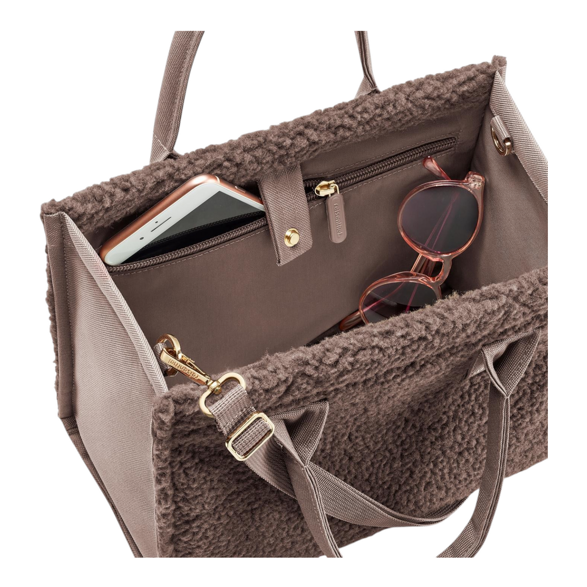 Lieblingstasche Daily Shopper XS in brown faux fur with internal pockets containing a smartphone and sunglasses