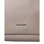 Close-up of the Lieblingstasche Dawn handbag in taupe leather with metallic aunts & uncles logo branding