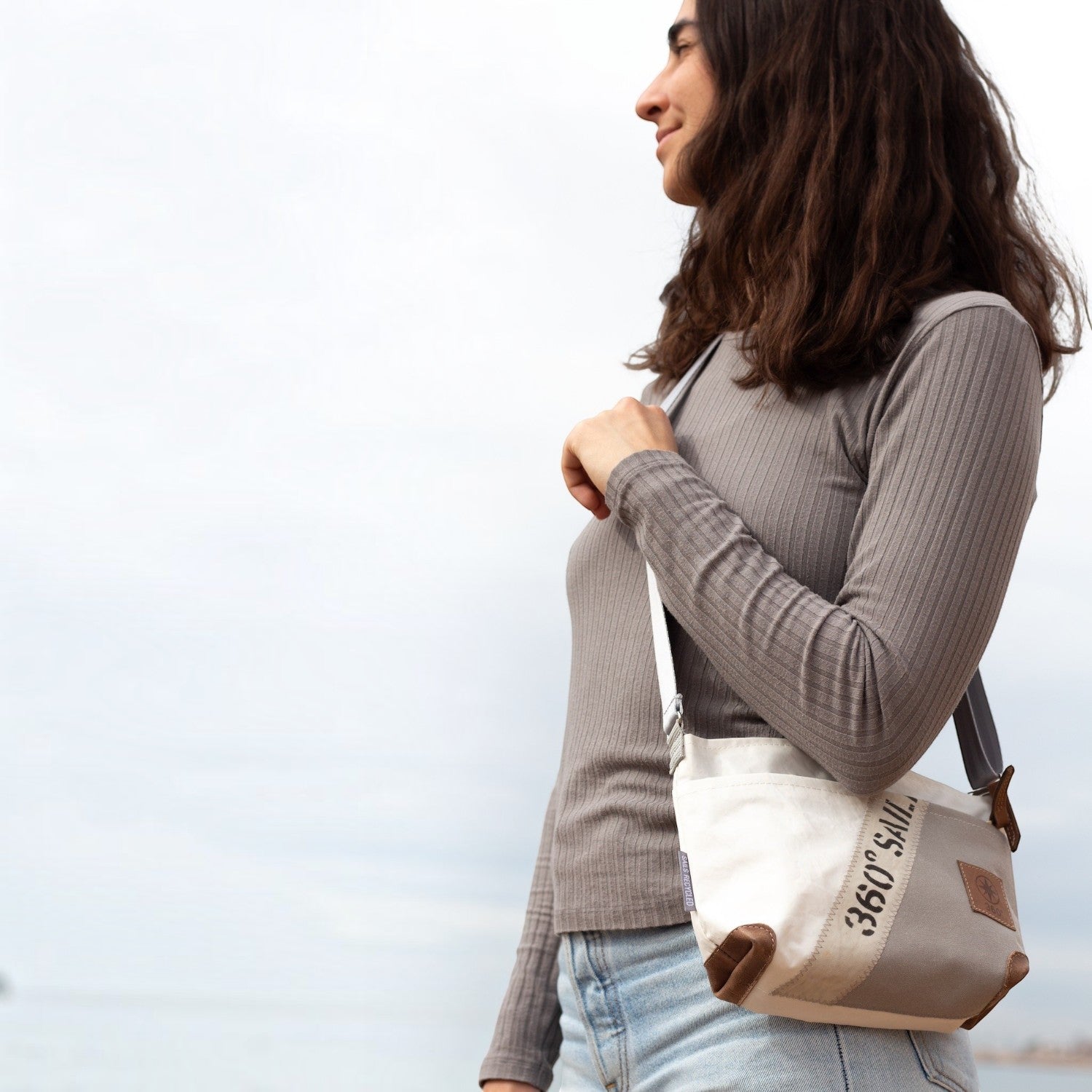 Lieblingstasche Deern Lütt crossbody bag made from recycled white and grey sailcloth with brown leather accents
