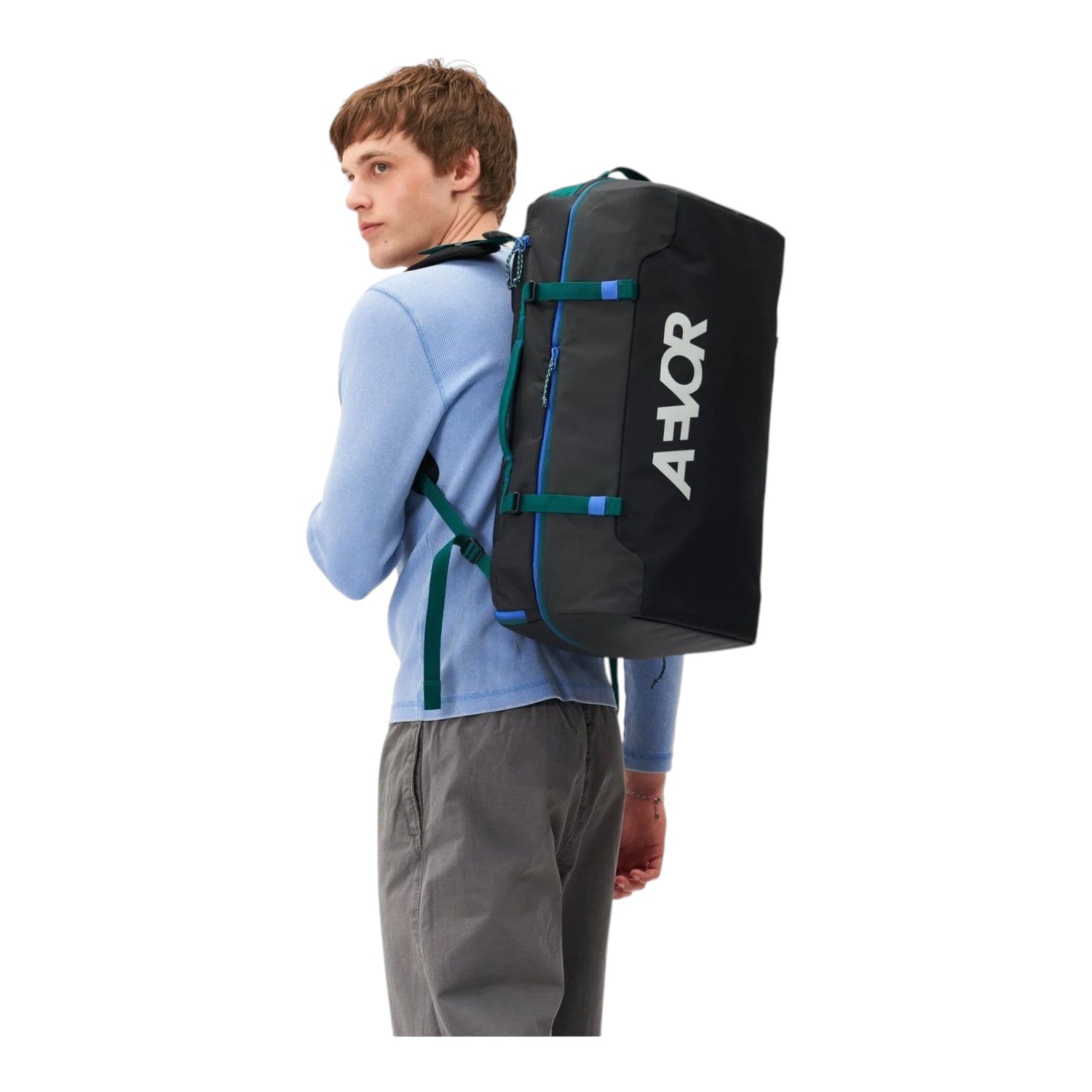 Lieblingstasche Duffel Pack in black with blue and green accents worn as a backpack by a man