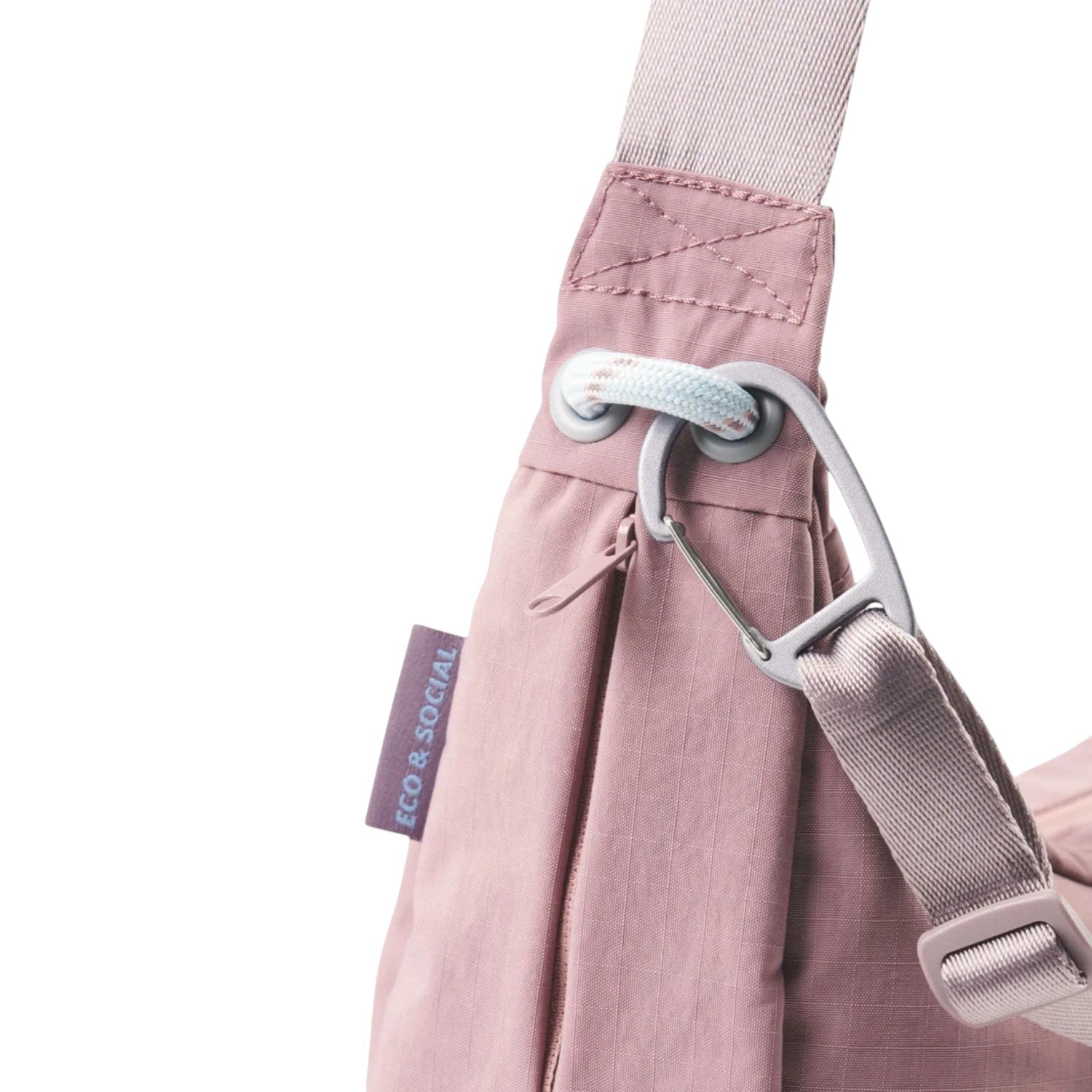 Lieblingstasche dusty pink sling bag with a carabiner clip, adjustable strap, and Eco & Social side label.