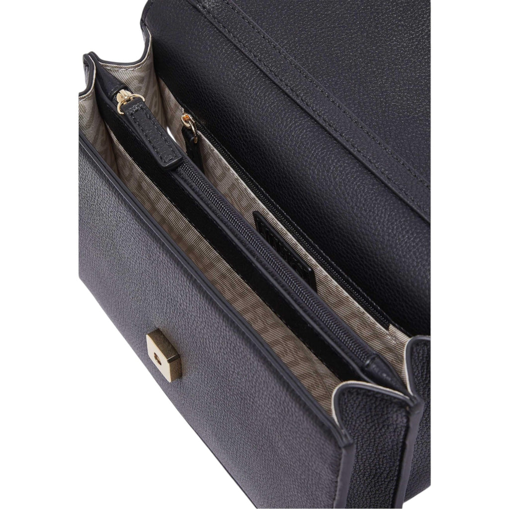 Lieblingstasche ECS Crossbody S bag interior featuring black pebbled leather, gold hardware, and lined compartments.