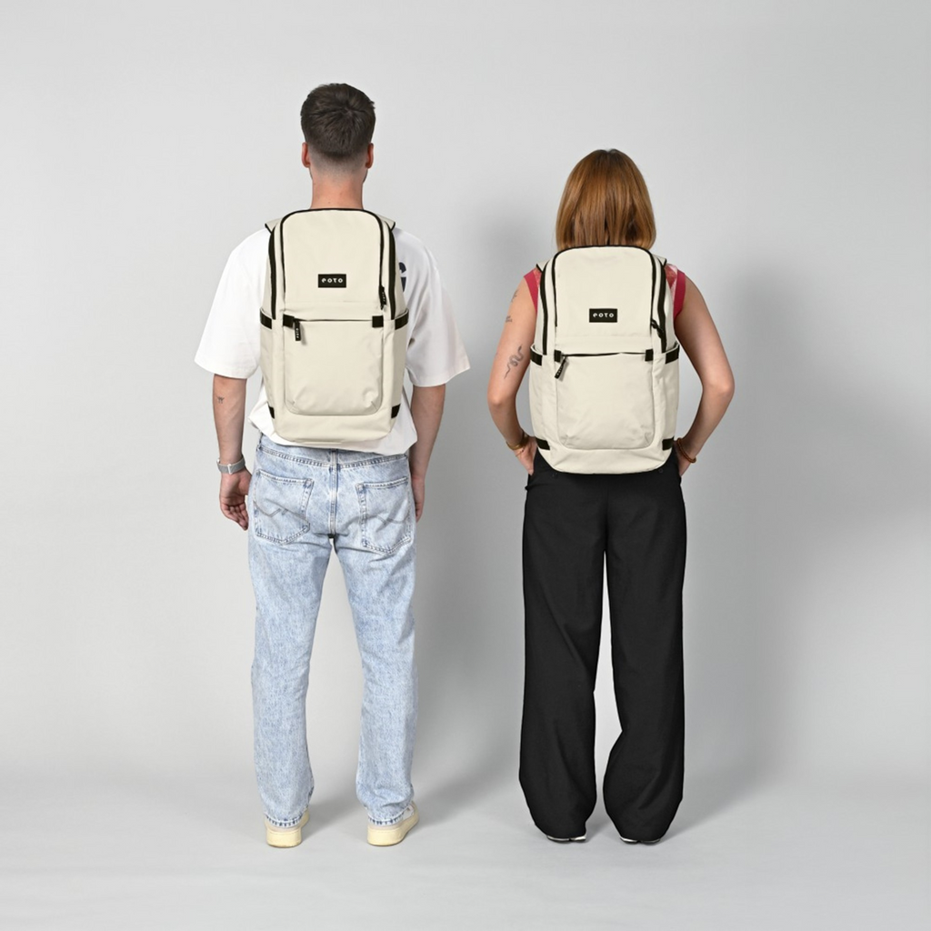Lieblingstasche eoto Easy27 beige everyday backpack worn by a man and woman against a light grey background