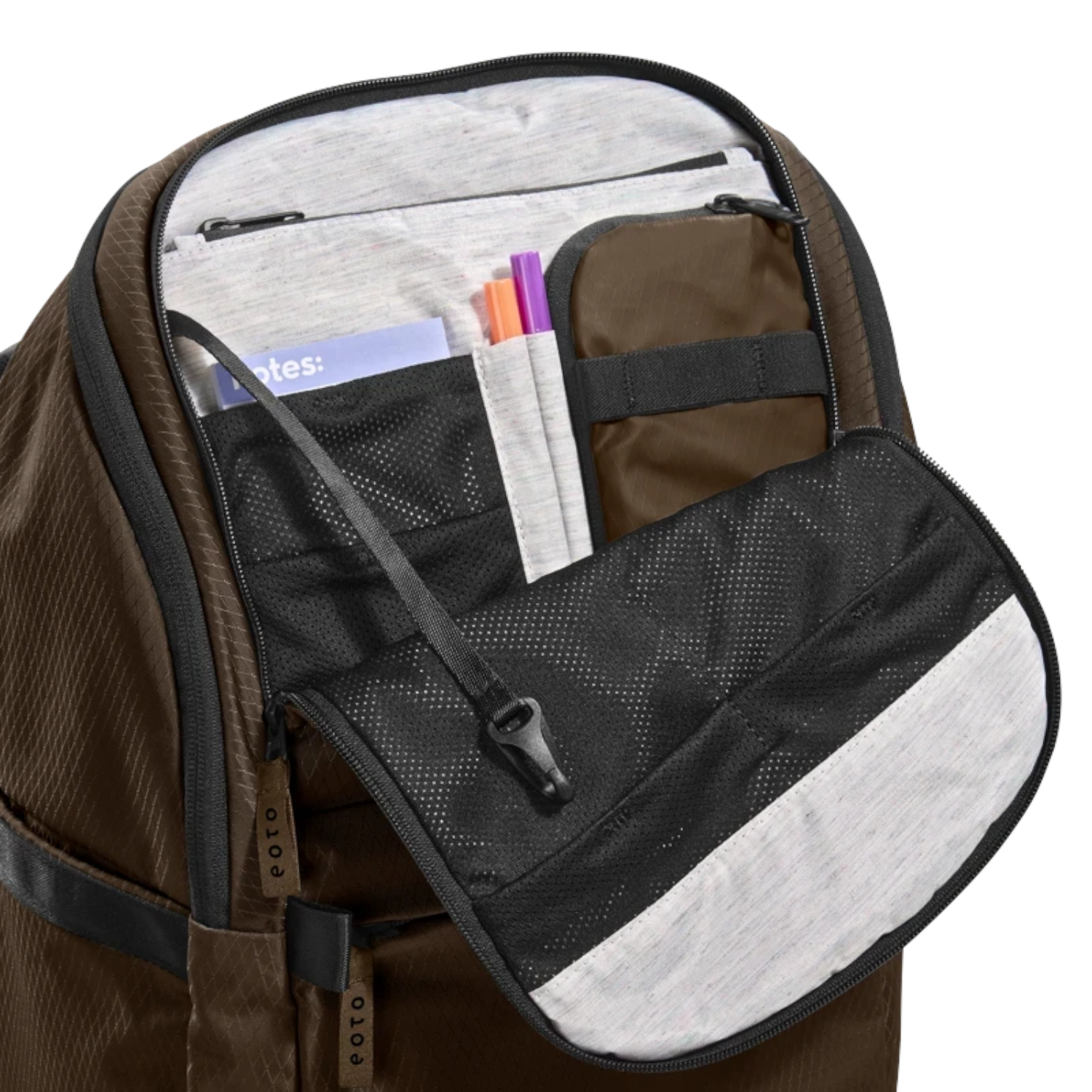 Lieblingstasche eoto Easy27 brown backpack showing the open front organizer compartment with mesh pockets and pen slots