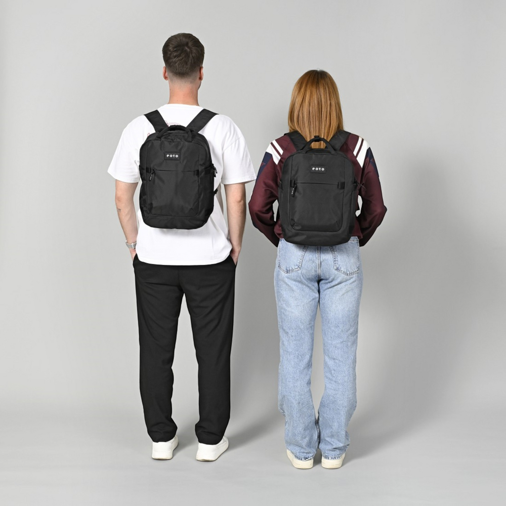 Lieblingstasche eoto Small16 black daypack worn by a man and a woman, showing the compact recycled material design.