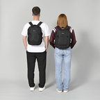 Lieblingstasche eoto Small16 black daypack worn by a man and a woman, showing the compact recycled material design.