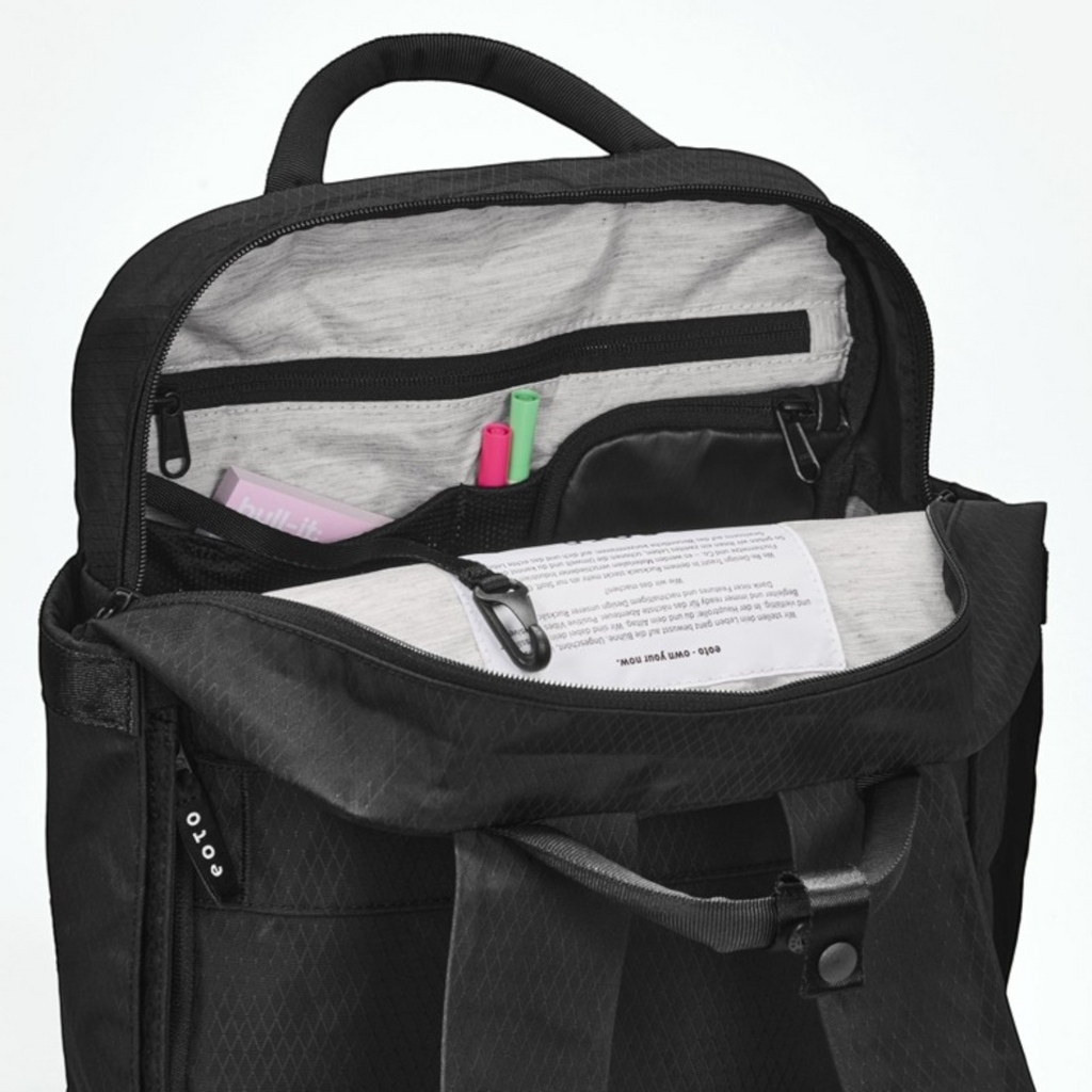 Lieblingstasche eoto Small16 black daypack with open main compartment showing interior organizer pockets and laptop sleeve