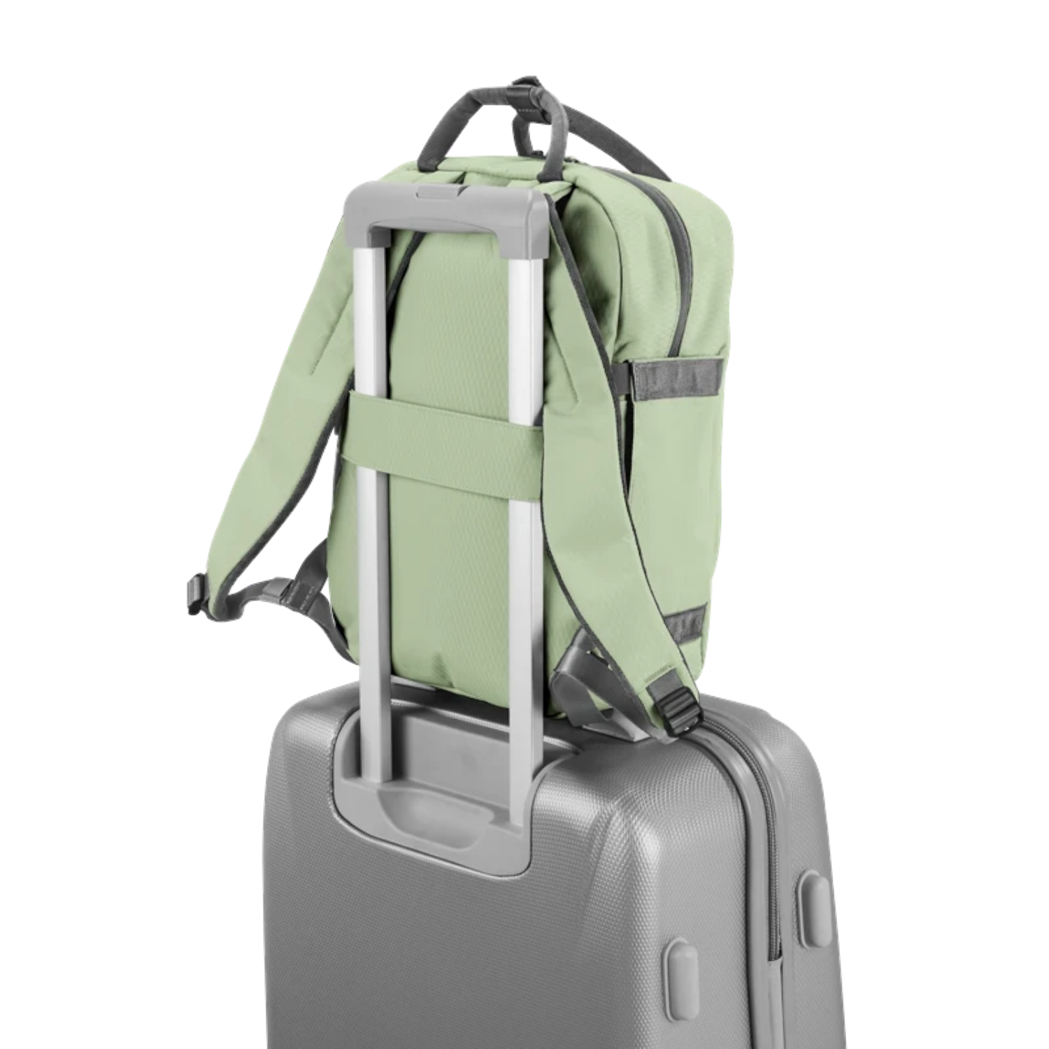 Lieblingstasche eoto Small16 sage green compact daypack attached to a grey rolling suitcase handle