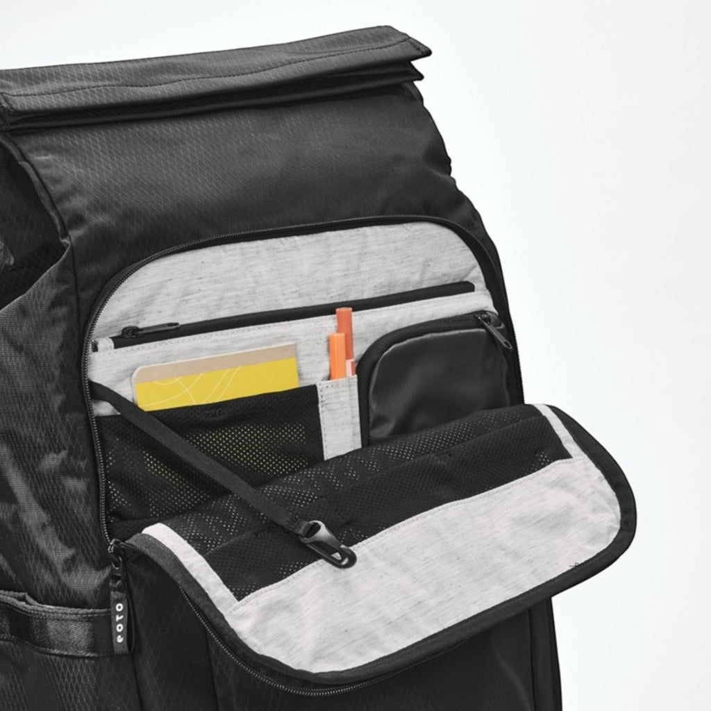 Lieblingstasche eoto Tall41 black rolltop backpack showing the open front organizer pocket with mesh and pen slots