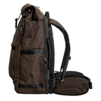 Lieblingstasche eoto Tall41 brown rolltop travel backpack with side view showing padded straps and hip belt