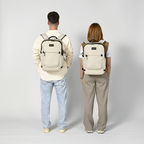 Lieblingstasche eoto Tidy22 beige business backpack worn by a man and woman, showing minimalist design and straps.