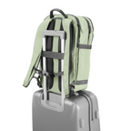 Lieblingstasche eoto Tidy22 sage green business backpack attached to a grey rolling suitcase handle