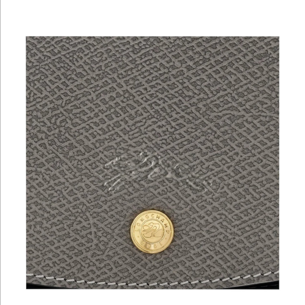Lieblingstasche Epure grey leather handbag close-up with gold button detail and embossed logo