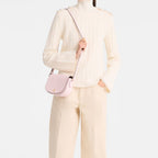 Lieblingstasche Epure S light pink leather crossbody bag with gold hardware and a small gold logo.