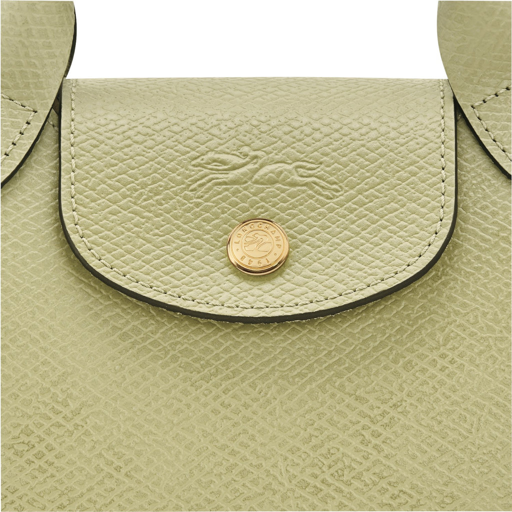 Lieblingstasche Epure XS light green textured leather crossbody bag with gold hardware and embossed logo.