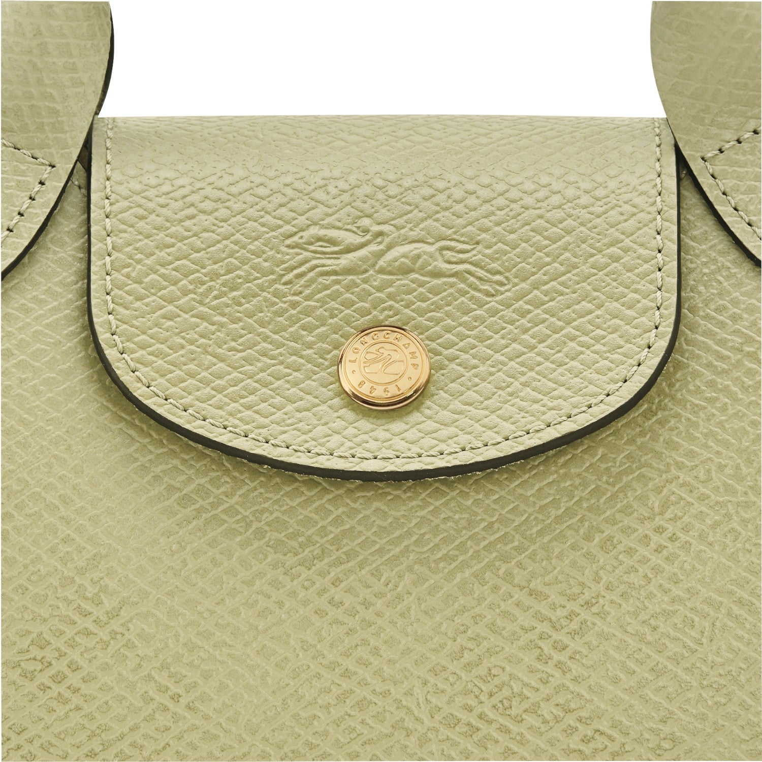 Lieblingstasche Epure XS light green textured leather crossbody bag with gold hardware and embossed logo.